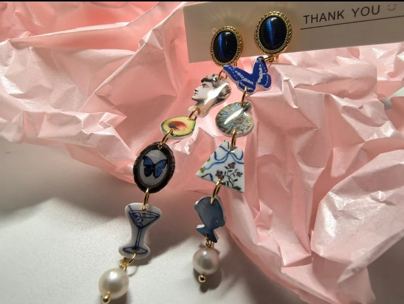 product:mismatched-charm-earrings