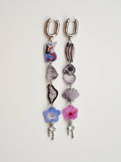 Ocean Earrings — Mismatched Graphic Charm Earrings with retro mermaid and Dalí clock, handcrafted resin composite by HERIZONE