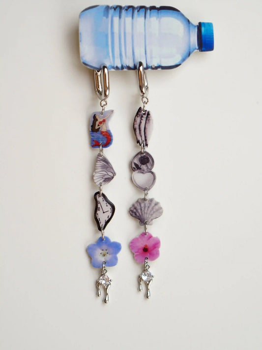 Asymmetrical dangle earrings with butterfly wing and seashell charms, soft blue cabochon tops — wearable art by HERIZONE