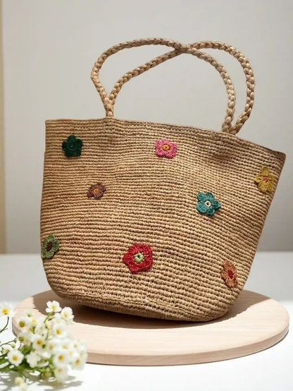 Handwoven straw tote bag with multicolor 3D crochet flower appliqués, large natural fiber basket handbag with braided handles for summer