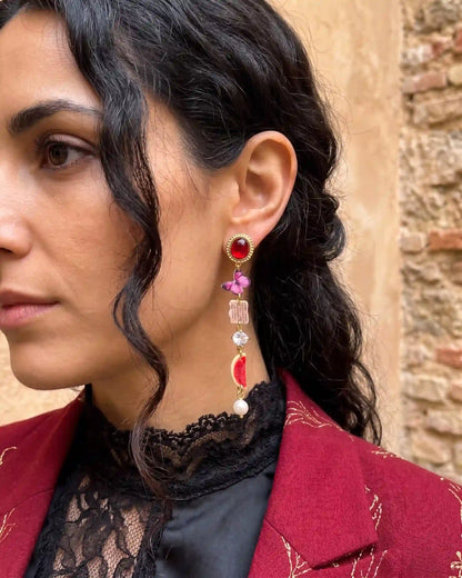 Asymmetrical dangle earrings with surreal eye motif, cowboy boot and watermelon charms, classic pearl drops