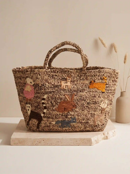 Large handwoven raffia tote bag with colorful embroidered animal patterns, artisan crochet basket bag with whimsical folk art design