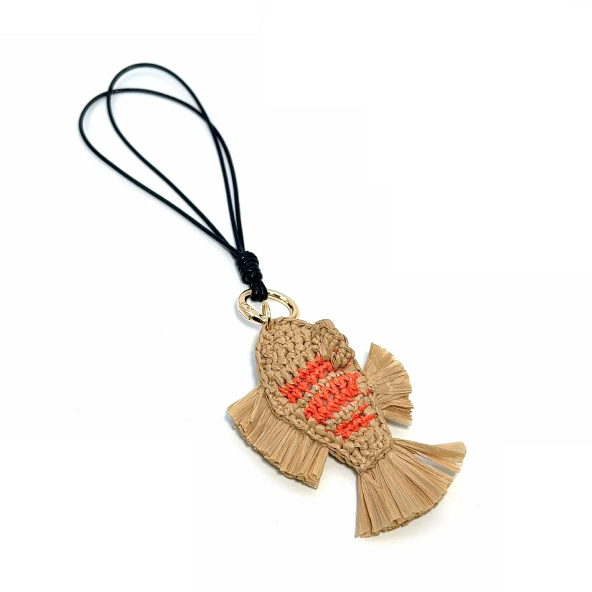 Hand-crocheted raffia fish charm showing orange stitched stripes, textured fringe, and a gold-tone ring.