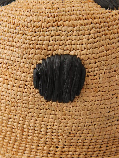 Natural raffia straw weave detail – artisan handwoven sun hat texture close-up